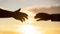 Outstretched hands, salvation, help silhouette, concept of help. Giving a helping hand. Rescue, helping gesture or hands Royalty Free Stock Photo