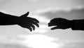 Outstretched hands, salvation, help silhouette, concept of help. Giving a helping hand. Rescue, helping gesture or hands Royalty Free Stock Photo