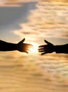 Outstretched hands, salvation, help silhouette, concept of help. Giving a helping hand. Rescue, helping gesture or hands Royalty Free Stock Photo