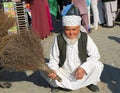 Unidentified Afghan Man Selling his handmade Sweeper at Local Farmers Market in Ovakent, Hatay, Turkey