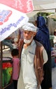 Unidentified Afghan Man walking at farmers market