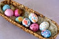 Oval basket full of brightly colored Easter eggs Royalty Free Stock Photo