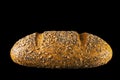 Cereal bread in profile, on black background Royalty Free Stock Photo