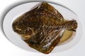 Oval dish with baked turbot fish Royalty Free Stock Photo