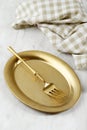 Oval Golden Plate with Golden Fork