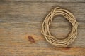 Oval hank of packthread over wooden texture Royalty Free Stock Photo