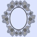 Oval lace frame on blue background. Black openwork with flowers.