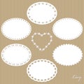 Oval lacy doilies big set on cardboard background.