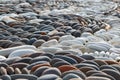Oval pebbles or stones are laid in a pattern Royalty Free Stock Photo