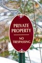 Oval shape Private Property No Trespassing sign with red and white colors