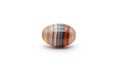 Oval shaped agate stone displayed against a white background Royalty Free Stock Photo