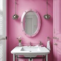 An oval shaped mirror with a pink frame finish and a white ceramic sink with a stainless-steel finish