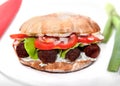 Oval vegan sandwich with soya barbecue cevapcici