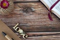 ove wooden text with heart, old key, open holy bible book, pen and vintage paper on rustic table with copy space, top view Royalty Free Stock Photo
