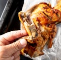 Oven baked chicken in foil. Hand cook man