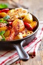 Oven-baked chicken with vegetables and fresh herbs. Royalty Free Stock Photo