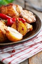 Oven-baked chicken with vegetables and fresh herbs. Royalty Free Stock Photo