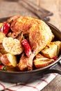 Oven-baked chicken with vegetables and fresh herbs. Homemade food. Symbolic Royalty Free Stock Photo