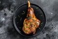 Oven baked lamb leg. Dark background. Top view Royalty Free Stock Photo