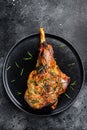 Oven baked lamb leg. Dark background. Top view Royalty Free Stock Photo