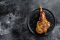 Oven baked lamb leg. Dark background. Top view. Copy space Royalty Free Stock Photo