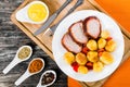 Oven Baked new potatoes with pork chop, mustard and spices Royalty Free Stock Photo