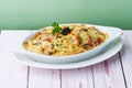 Oven-Baked Pasta Truffle Cream with cheese, olive, Pasta, chicken and vegetables gratin in baking dish