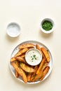 Oven baked potato wedges with sauce Royalty Free Stock Photo