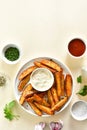 Oven baked potato wedges with sauce Royalty Free Stock Photo