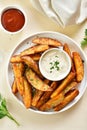 Oven baked potato wedges with sauce Royalty Free Stock Photo