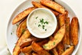 Oven baked potato wedges with sauce Royalty Free Stock Photo