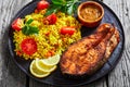 Oven baked salmon steak with yellow rice Royalty Free Stock Photo