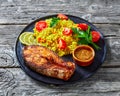 Oven baked salmon steak with yellow rice Royalty Free Stock Photo