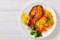 Oven baked salmon steak with yellow rice Royalty Free Stock Photo