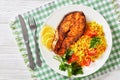Oven baked salmon steak with yellow rice Royalty Free Stock Photo