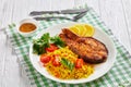 Oven baked salmon steak with yellow rice Royalty Free Stock Photo