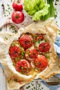 Oven baked tomatoes stuffed with spinach, cheese and herbs