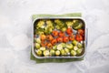 Oven baked vegetables with spices and herbs on baking tray. Grilled brussel sprouts, cherry tomatoes and broccoli. Top view, copy