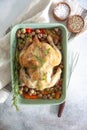 Oven bakes chicken with veggies and mushrooms Royalty Free Stock Photo