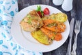 Oven cooked chicken with potato and sweet potato, spices , herbs in olive oil. Home cooking, healthy food concept. Royalty Free Stock Photo