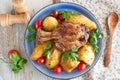 Oven cooked pork shank with potato