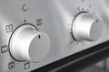 Oven cooking temperature control knob. Kitchen equipment panel detail Royalty Free Stock Photo