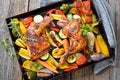 Oven roasted chicken legs with vegetables Royalty Free Stock Photo