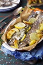 Oven roasted trout in a casserole on a rustic table