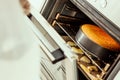 Oven`s opened doors with cookies inside Royalty Free Stock Photo