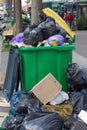 over-consumption, pollution and garbage containers bursting with plastic rubbish Royalty Free Stock Photo