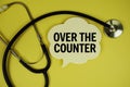 Over The Counter text on speech bubble with stethoscope on yellow background, Healthy concept Royalty Free Stock Photo