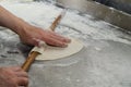 Over head view of a grandmother`s hands rolling out pasty dough. Royalty Free Stock Photo