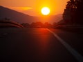Over the hill. Motorway sunset, with holidaymaker cars returning from vacation, holiday. Homeward bound. Genuine image Royalty Free Stock Photo