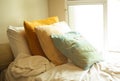 Over light from window with Cushions on bed. Royalty Free Stock Photo